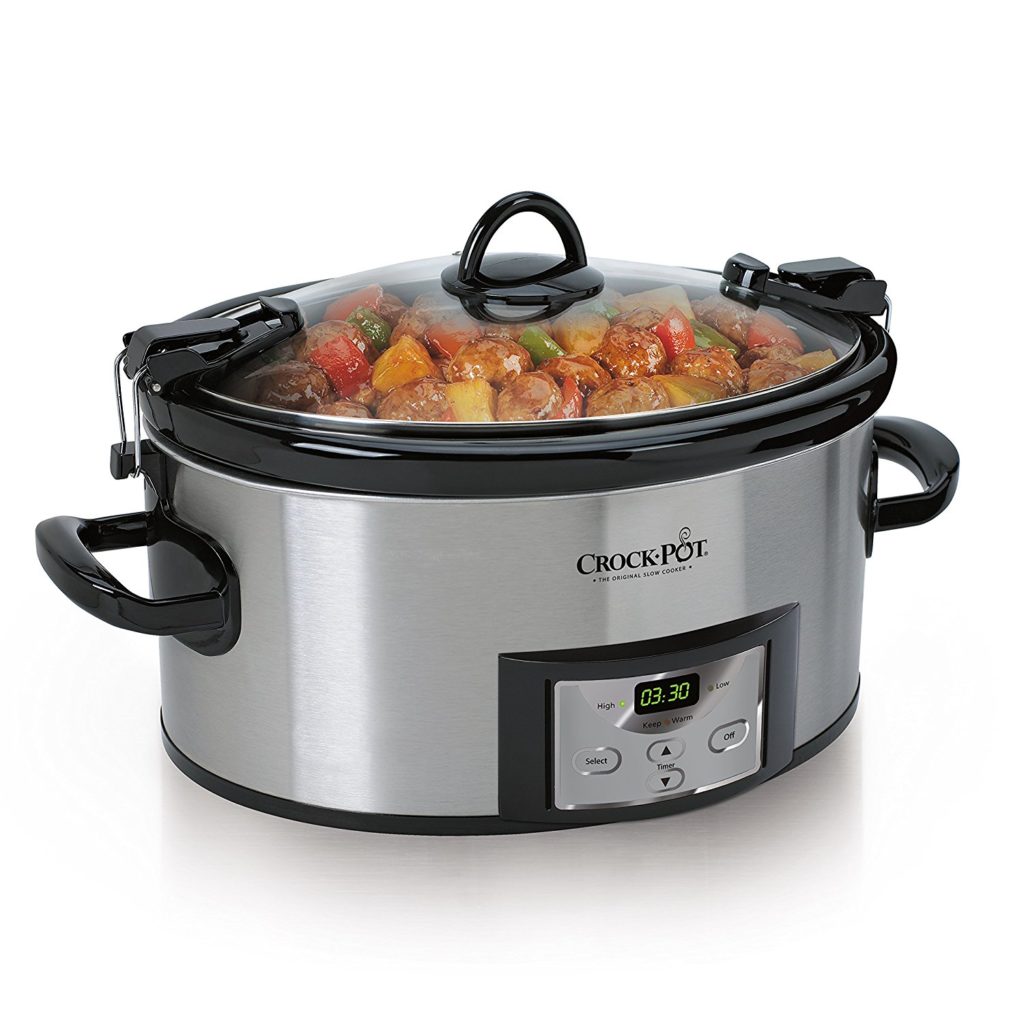 a stainless steel crock pot with sausage and peppers inside 