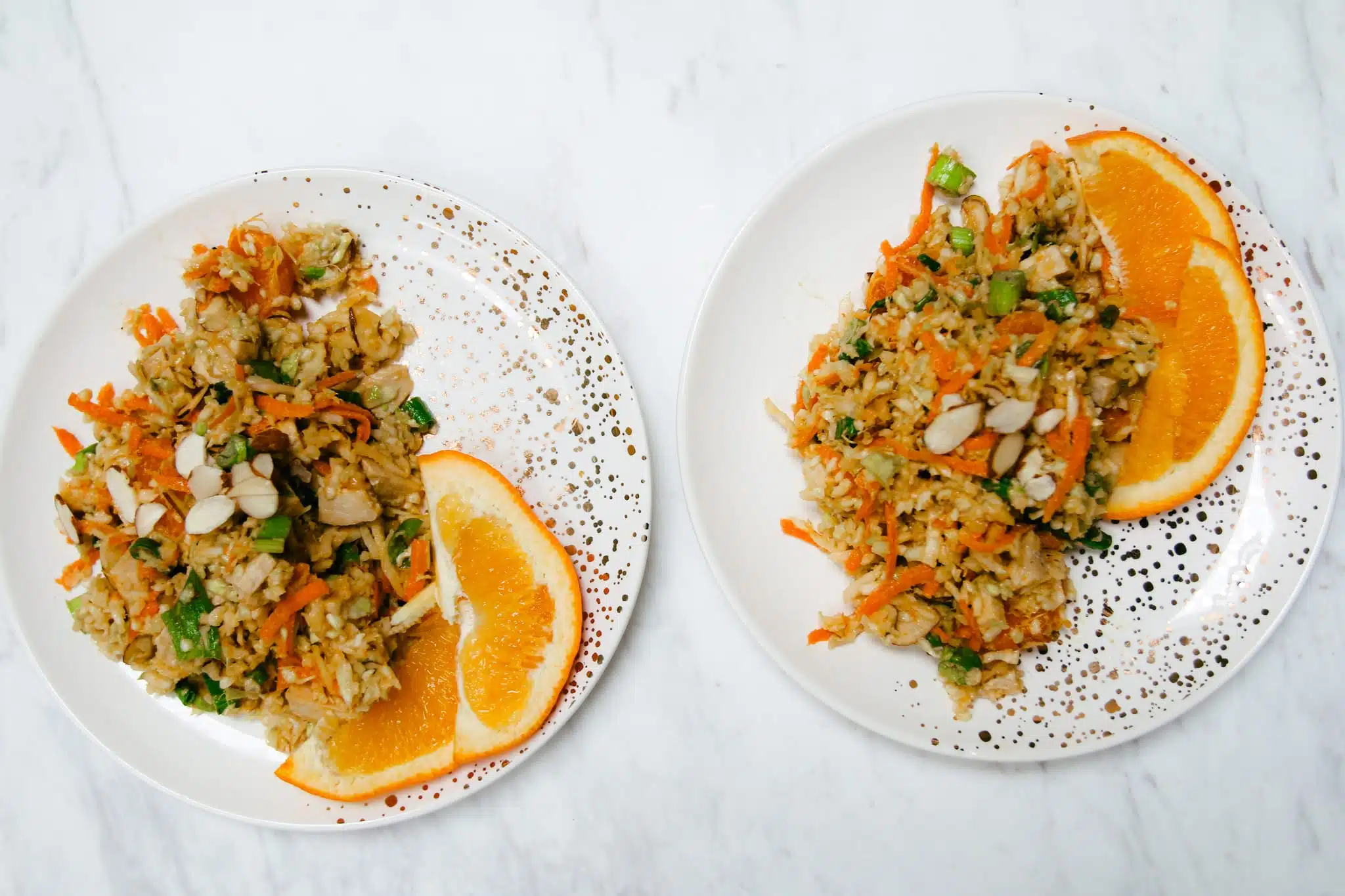 chopped chicken salad on plate with oranges