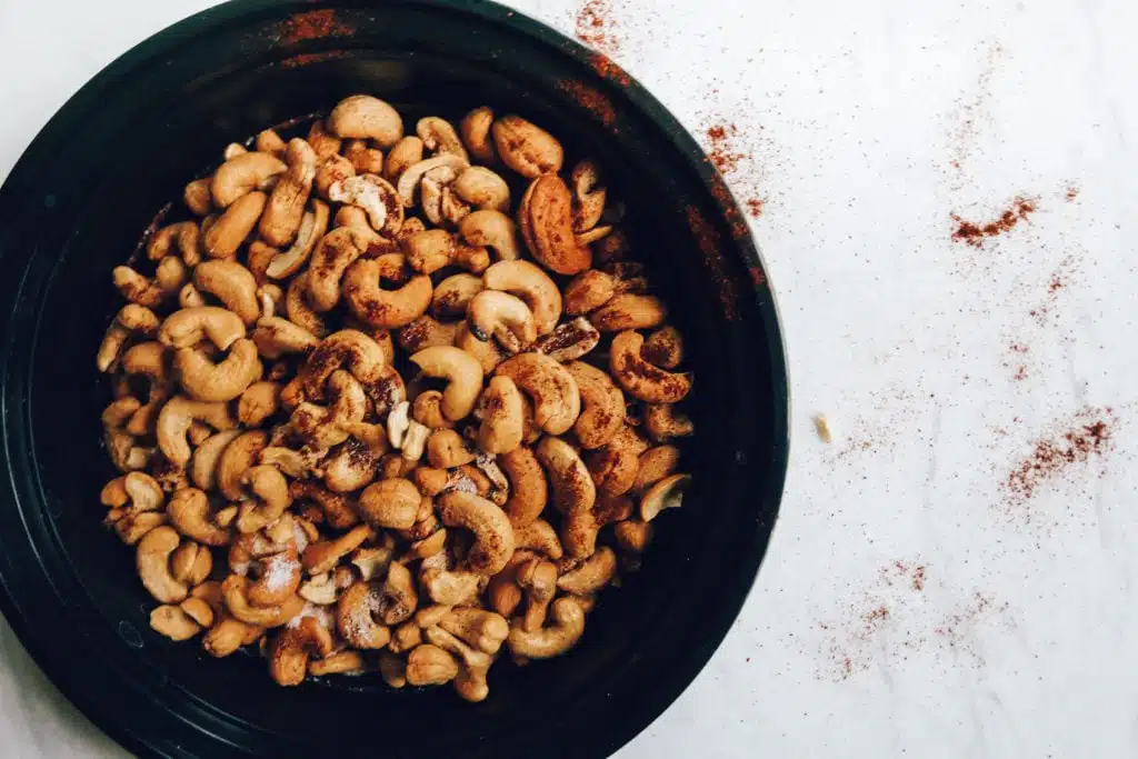 chili roasted cashews in black dish