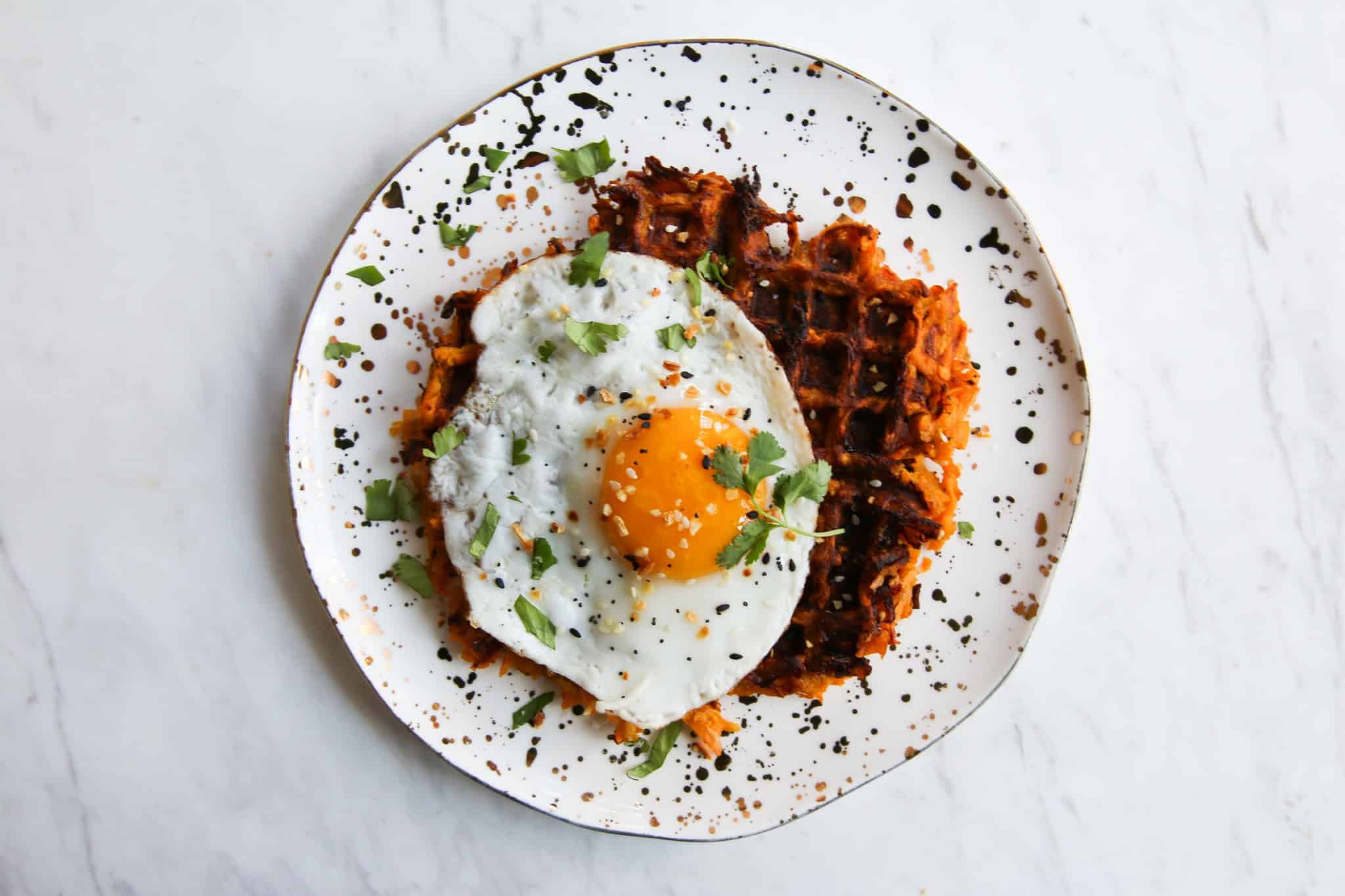 sweet potato waffle hashed browns with egg on top