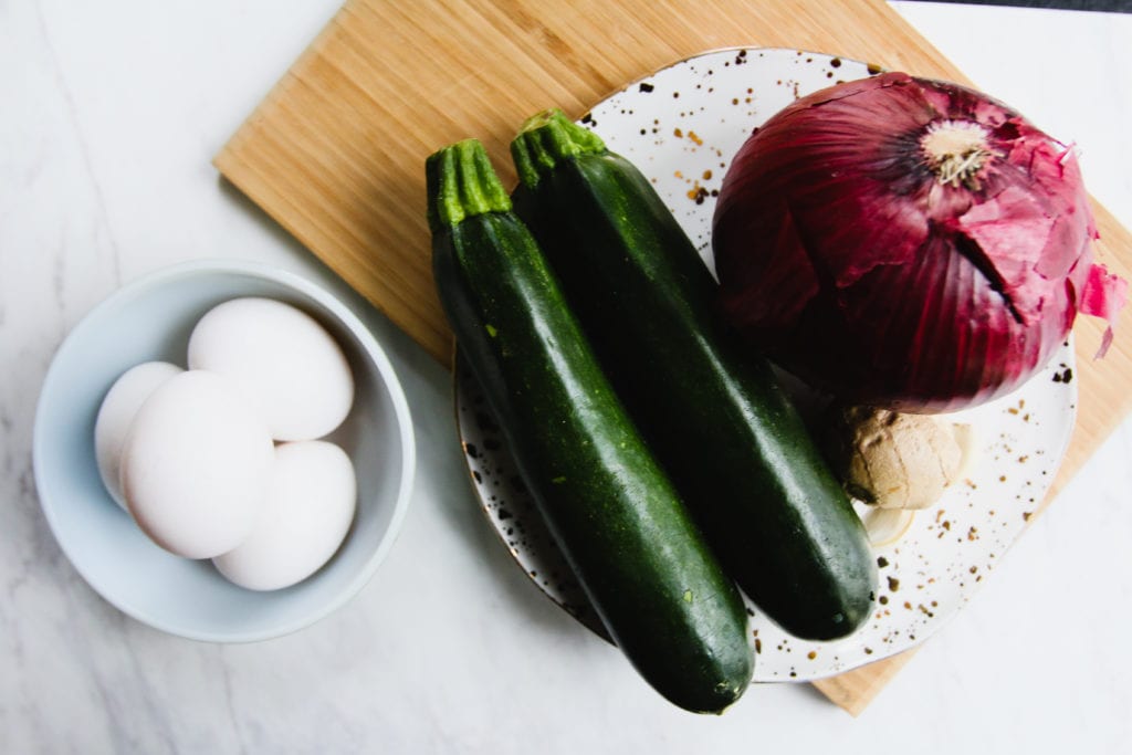 eggs zucchini red onion grated ginger on plate