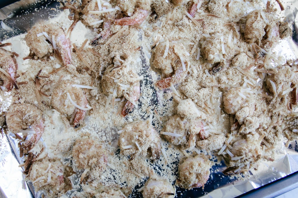 coconut almond flour battered shrimp on baking sheet