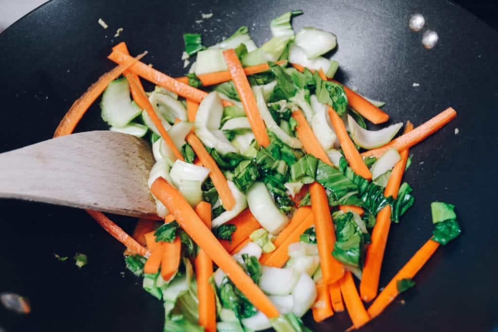 carrots and bok choy in skillet