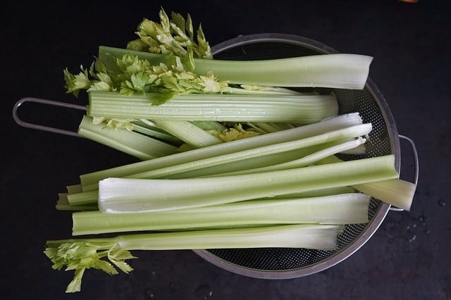 celery stalks in collander