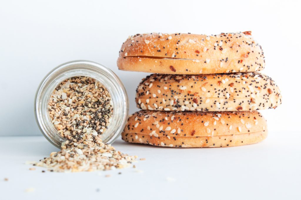 sesame seeds in jar and on bagel