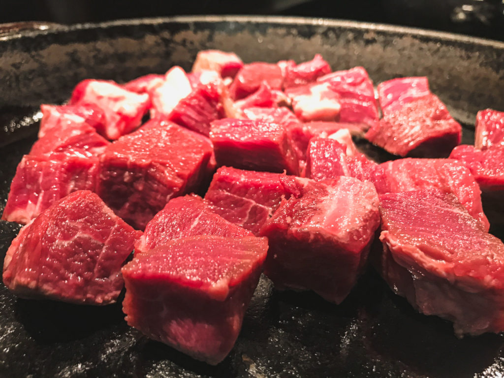 raw beef tenderloin in skillet