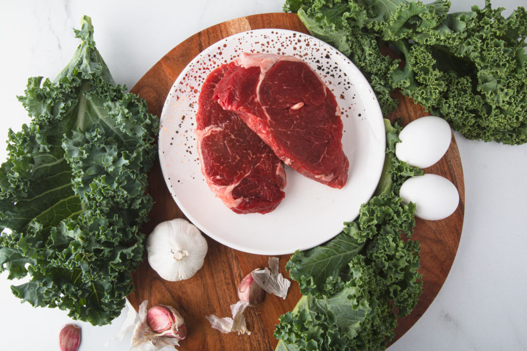 two beef tenderloins with kale