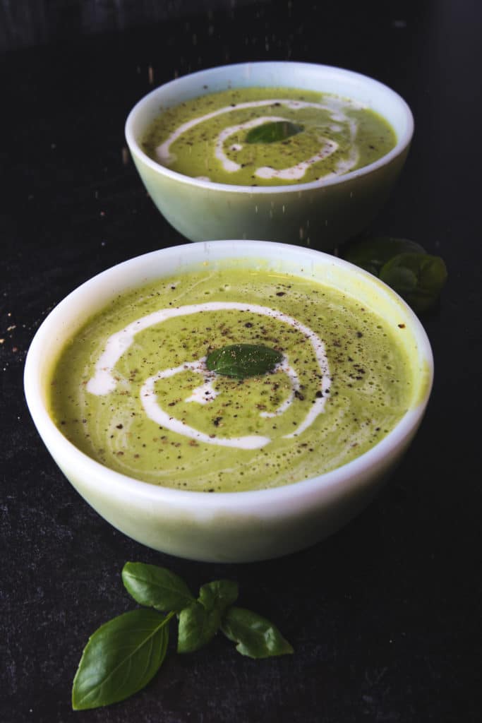 two bowls of zucchini soup